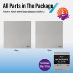 Hand holding a large gray microfiber cloth, with two gray cloths in sleeves and a gray retail package below