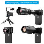 Black Apexel spring-loaded phone clamp with a threaded lens ring in the centre and a tripod screw hole on the side